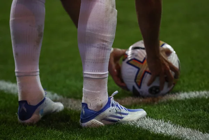 Player kicks the ball