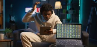 African american perso using his tablet laying couch