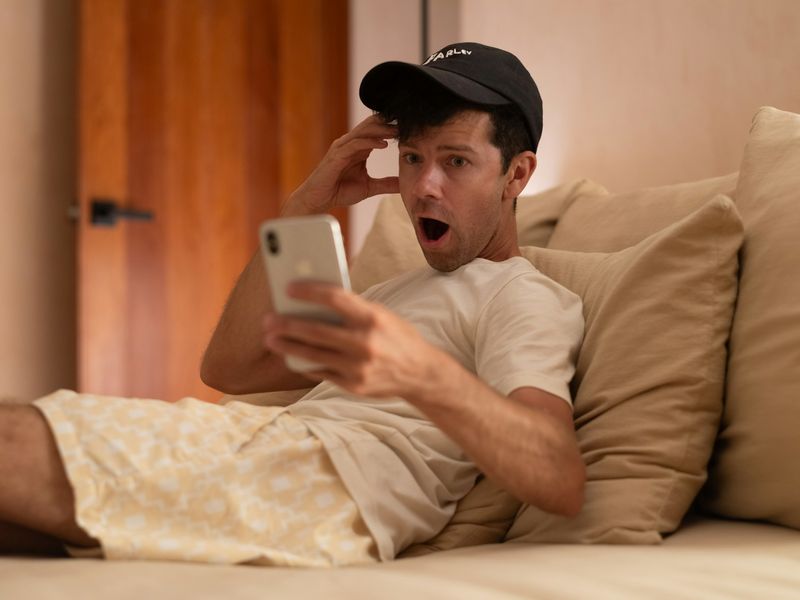 Man is shocked looking at his phone